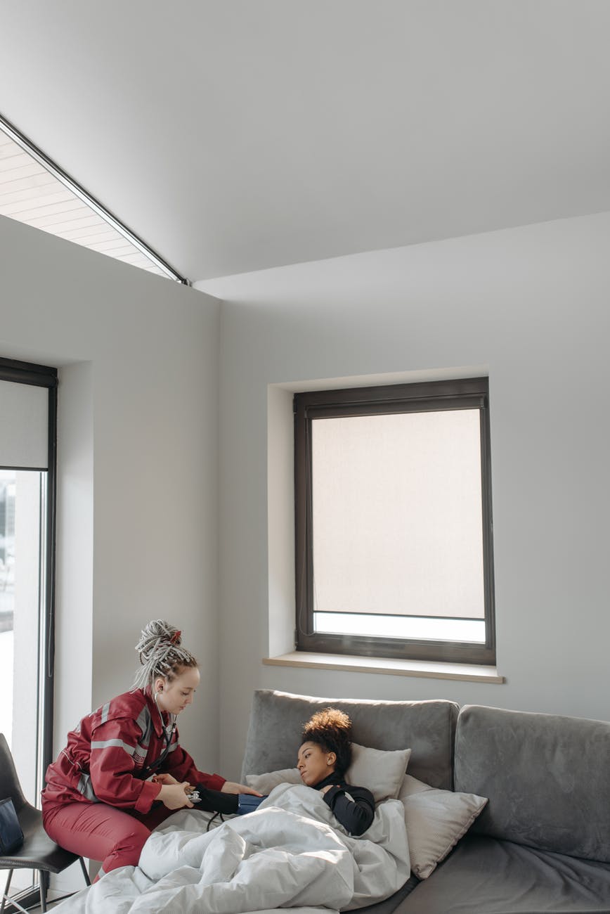 paramedic helping a woman